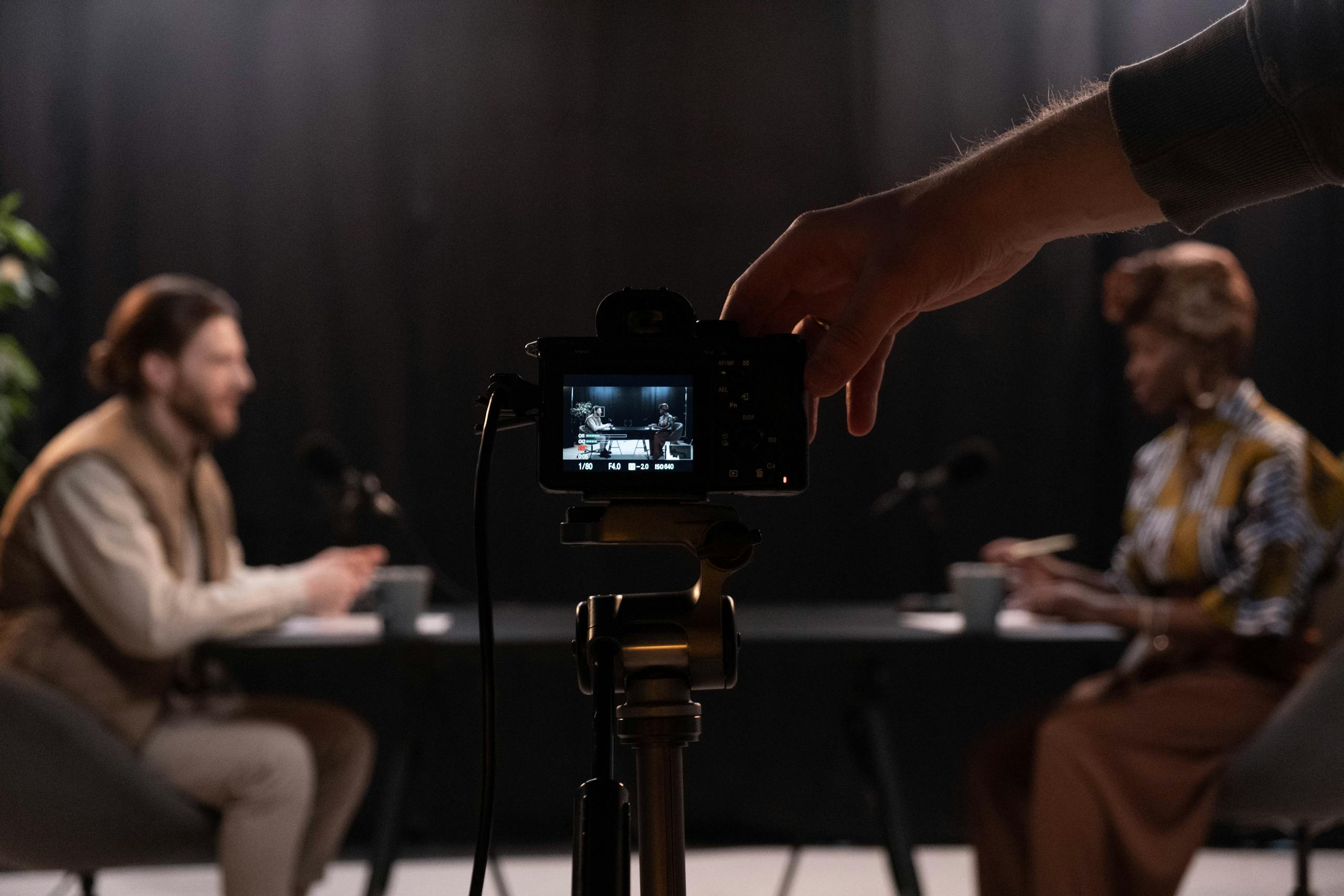 Professional podcast session recording with diverse hosts in studio.
